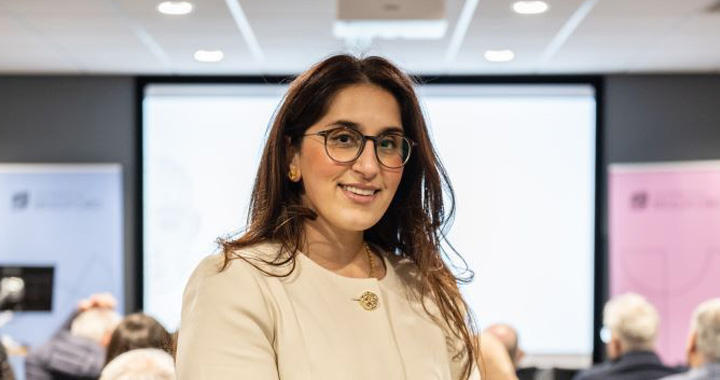 Dr Shelina Jilani posing in a lecture hall. Dr Shelina Jilani posing in a lecture hall.